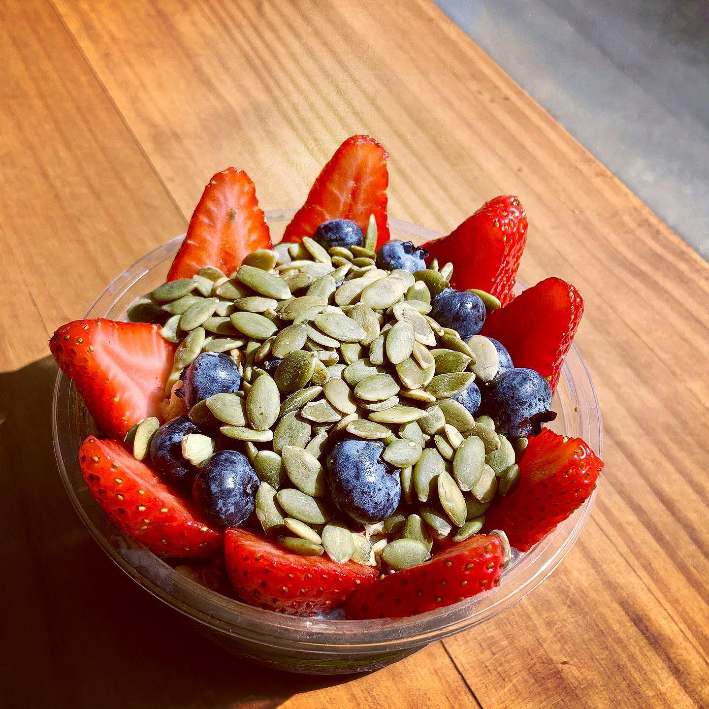 acai bowl very berries, strawberry and sunflower seeds
